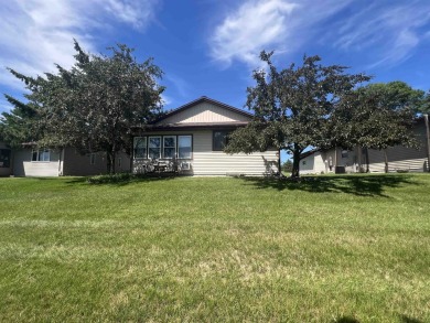 Ranch style stand-alone condo overlooking peaceful hole 4 of on Saddle Ridge Golf Club in Wisconsin - for sale on GolfHomes.com, golf home, golf lot