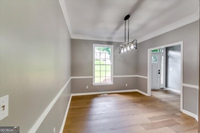 Embrace luxury living at its finest in this fully renovated on Canongate At Olde Atlanta Golf Club in Georgia - for sale on GolfHomes.com, golf home, golf lot