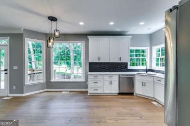 Embrace luxury living at its finest in this fully renovated on Canongate At Olde Atlanta Golf Club in Georgia - for sale on GolfHomes.com, golf home, golf lot
