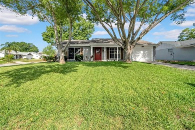 Welcome to 12401 Yorktown Lane, Bayonet Point, FL 34667. Step on Beacon Woods Golf Club in Florida - for sale on GolfHomes.com, golf home, golf lot