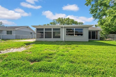 Welcome to 12401 Yorktown Lane, Bayonet Point, FL 34667. Step on Beacon Woods Golf Club in Florida - for sale on GolfHomes.com, golf home, golf lot