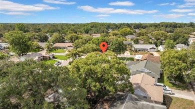 Welcome to 12401 Yorktown Lane, Bayonet Point, FL 34667. Step on Beacon Woods Golf Club in Florida - for sale on GolfHomes.com, golf home, golf lot