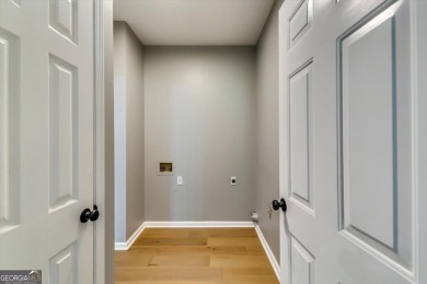 Embrace luxury living at its finest in this fully renovated on Canongate At Olde Atlanta Golf Club in Georgia - for sale on GolfHomes.com, golf home, golf lot