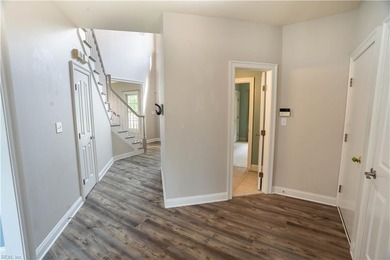 Step out of your home onto the 9th fairway.  This beautiful home on Riverfront Golf Club in Virginia - for sale on GolfHomes.com, golf home, golf lot