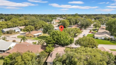 Welcome to 12401 Yorktown Lane, Bayonet Point, FL 34667. Step on Beacon Woods Golf Club in Florida - for sale on GolfHomes.com, golf home, golf lot