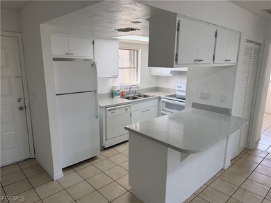 Solid concrete block duplex featuring two 2-bedroom, 2-bath on Estero Country Club in Florida - for sale on GolfHomes.com, golf home, golf lot