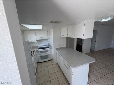 Solid concrete block duplex featuring two 2-bedroom, 2-bath on Estero Country Club in Florida - for sale on GolfHomes.com, golf home, golf lot