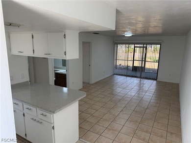 Solid concrete block duplex featuring two 2-bedroom, 2-bath on Estero Country Club in Florida - for sale on GolfHomes.com, golf home, golf lot