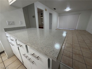 Solid concrete block duplex featuring two 2-bedroom, 2-bath on Estero Country Club in Florida - for sale on GolfHomes.com, golf home, golf lot