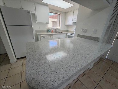 Solid concrete block duplex featuring two 2-bedroom, 2-bath on Estero Country Club in Florida - for sale on GolfHomes.com, golf home, golf lot