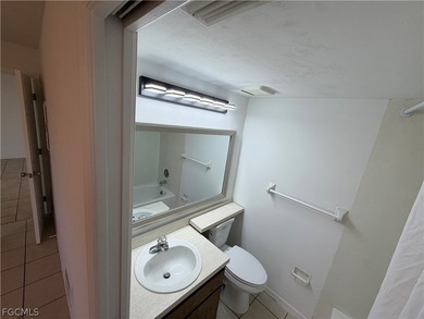 Solid concrete block duplex featuring two 2-bedroom, 2-bath on Estero Country Club in Florida - for sale on GolfHomes.com, golf home, golf lot