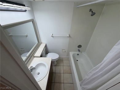 Solid concrete block duplex featuring two 2-bedroom, 2-bath on Estero Country Club in Florida - for sale on GolfHomes.com, golf home, golf lot