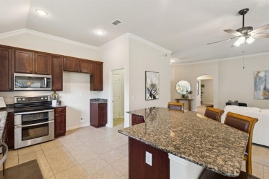 Nestled in a beautifully landscaped setting and shaded by mature on Wildhorse Golf Club of Robson Ranch in Texas - for sale on GolfHomes.com, golf home, golf lot