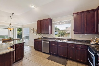 Nestled in a beautifully landscaped setting and shaded by mature on Wildhorse Golf Club of Robson Ranch in Texas - for sale on GolfHomes.com, golf home, golf lot
