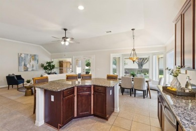 Nestled in a beautifully landscaped setting and shaded by mature on Wildhorse Golf Club of Robson Ranch in Texas - for sale on GolfHomes.com, golf home, golf lot