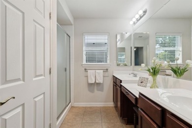 Nestled in a beautifully landscaped setting and shaded by mature on Wildhorse Golf Club of Robson Ranch in Texas - for sale on GolfHomes.com, golf home, golf lot