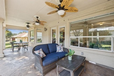 Nestled in a beautifully landscaped setting and shaded by mature on Wildhorse Golf Club of Robson Ranch in Texas - for sale on GolfHomes.com, golf home, golf lot