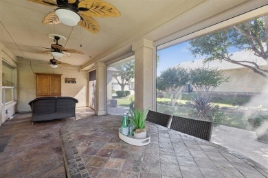 Nestled in a beautifully landscaped setting and shaded by mature on Wildhorse Golf Club of Robson Ranch in Texas - for sale on GolfHomes.com, golf home, golf lot