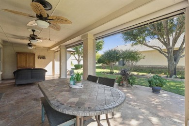 Nestled in a beautifully landscaped setting and shaded by mature on Wildhorse Golf Club of Robson Ranch in Texas - for sale on GolfHomes.com, golf home, golf lot