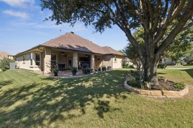 Nestled in a beautifully landscaped setting and shaded by mature on Wildhorse Golf Club of Robson Ranch in Texas - for sale on GolfHomes.com, golf home, golf lot
