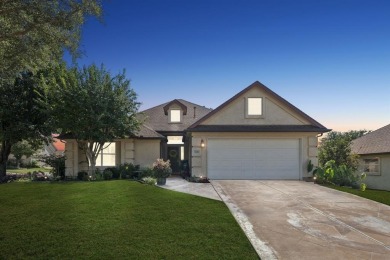 Nestled in a beautifully landscaped setting and shaded by mature on Wildhorse Golf Club of Robson Ranch in Texas - for sale on GolfHomes.com, golf home, golf lot