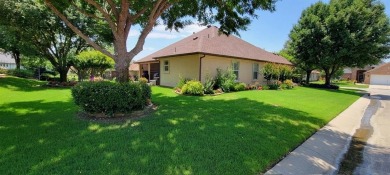 Nestled in a beautifully landscaped setting and shaded by mature on Wildhorse Golf Club of Robson Ranch in Texas - for sale on GolfHomes.com, golf home, golf lot