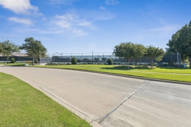 Nestled in a beautifully landscaped setting and shaded by mature on Wildhorse Golf Club of Robson Ranch in Texas - for sale on GolfHomes.com, golf home, golf lot