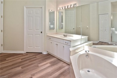 Nestled within the serene and gated Estero Country Club - The on Estero Country Club in Florida - for sale on GolfHomes.com, golf home, golf lot