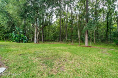 Elegant 4BR/3BA Gated with Guarded on .97 acre! A Beautifully on Country Club of Orange Park in Florida - for sale on GolfHomes.com, golf home, golf lot