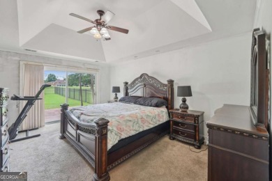 Welcome home to this beautiful all-brick ranch in the on Canongate At Georgia National Golf Club in Georgia - for sale on GolfHomes.com, golf home, golf lot