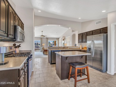 Beautifully maintained expanded Palmera model on the 14th green on Eagles Nest at Pebble Creek in Arizona - for sale on GolfHomes.com, golf home, golf lot