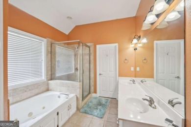 Welcome home to this beautiful all-brick ranch in the on Canongate At Georgia National Golf Club in Georgia - for sale on GolfHomes.com, golf home, golf lot