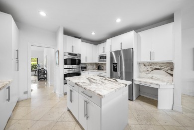 Sunny & warm tropical paradise! This beautifully updated & on Bocaire Country Club in Florida - for sale on GolfHomes.com, golf home, golf lot