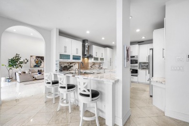 Sunny & warm tropical paradise! This beautifully updated & on Bocaire Country Club in Florida - for sale on GolfHomes.com, golf home, golf lot