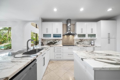 Sunny & warm tropical paradise! This beautifully updated & on Bocaire Country Club in Florida - for sale on GolfHomes.com, golf home, golf lot