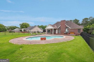 Welcome home to this beautiful all-brick ranch in the on Canongate At Georgia National Golf Club in Georgia - for sale on GolfHomes.com, golf home, golf lot