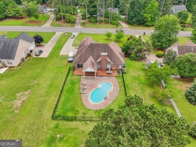 Welcome home to this beautiful all-brick ranch in the on Canongate At Georgia National Golf Club in Georgia - for sale on GolfHomes.com, golf home, golf lot