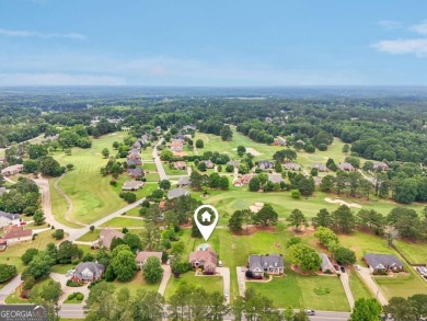Welcome home to this beautiful all-brick ranch in the on Canongate At Georgia National Golf Club in Georgia - for sale on GolfHomes.com, golf home, golf lot