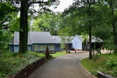Don't miss this modern, sophisticated oasis tucked away in one on Helena Country Club in Arkansas - for sale on GolfHomes.com, golf home, golf lot