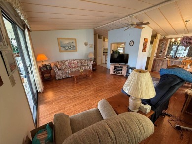Welcome to this beautifully decorated home on the 7th Hole! on Orange Blossom Hills Golf and Country Club in Florida - for sale on GolfHomes.com, golf home, golf lot