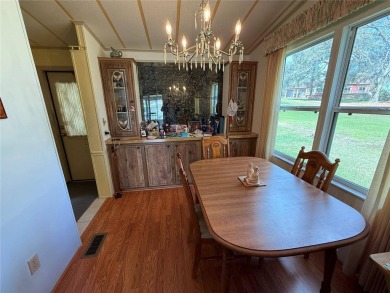 Welcome to this beautifully decorated home on the 7th Hole! on Orange Blossom Hills Golf and Country Club in Florida - for sale on GolfHomes.com, golf home, golf lot