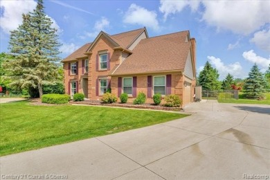Welcome to 100 Mornington Ct. A beautifully updated brick on Pheasant Run Golf Club in Michigan - for sale on GolfHomes.com, golf home, golf lot