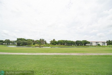 Step into the epitome of serene living with this delightful on Wynmoor Golf Course in Florida - for sale on GolfHomes.com, golf home, golf lot