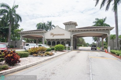 Step into the epitome of serene living with this delightful on Wynmoor Golf Course in Florida - for sale on GolfHomes.com, golf home, golf lot