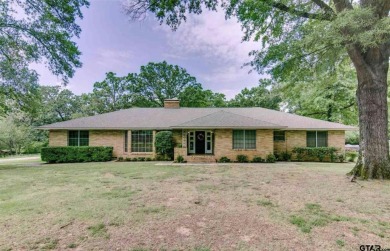 Welcome to this beautifully crafted ranch-style residence that on Mount Pleasant Country Club in Texas - for sale on GolfHomes.com, golf home, golf lot