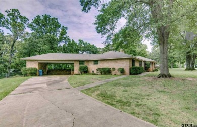 Welcome to this beautifully crafted ranch-style residence that on Mount Pleasant Country Club in Texas - for sale on GolfHomes.com, golf home, golf lot