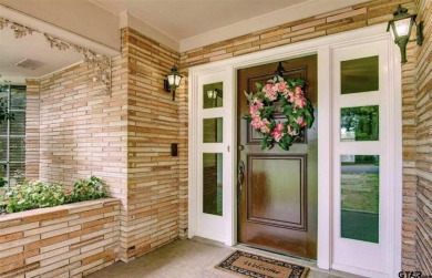 Welcome to this beautifully crafted ranch-style residence that on Mount Pleasant Country Club in Texas - for sale on GolfHomes.com, golf home, golf lot