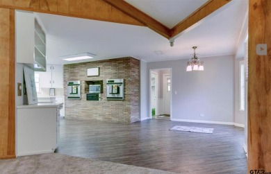 Welcome to this beautifully crafted ranch-style residence that on Mount Pleasant Country Club in Texas - for sale on GolfHomes.com, golf home, golf lot