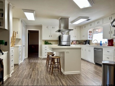 Welcome to this beautifully crafted ranch-style residence that on Mount Pleasant Country Club in Texas - for sale on GolfHomes.com, golf home, golf lot