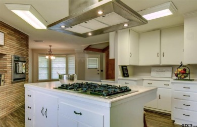 Welcome to this beautifully crafted ranch-style residence that on Mount Pleasant Country Club in Texas - for sale on GolfHomes.com, golf home, golf lot